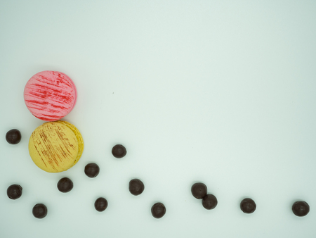 Sweet cake macaron and colorful almond macaron cookies on white background with copy space for text.の写真素材