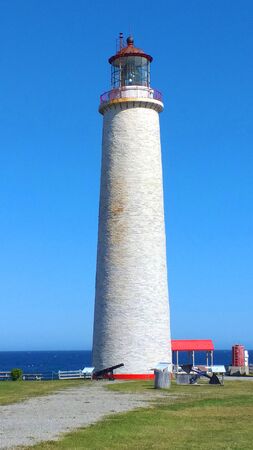 Cap des Rosiers Lighthouse on the shores of the St Lawrence river Gaspésie Québec Canadaの写真素材