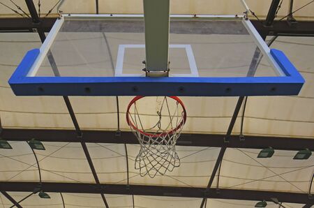 View from below of a basketball basket in a municipal sports hall. Caribbean village French West Indiesの写真素材