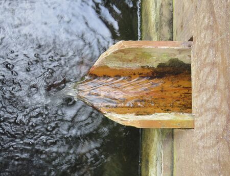 Detail of water falling in rural watering holeの写真素材