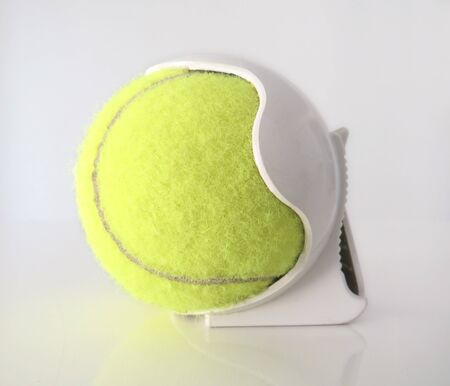 Isolated Tennis ball with white plastic clip-On Tennis Ball Holder. White background.の写真素材