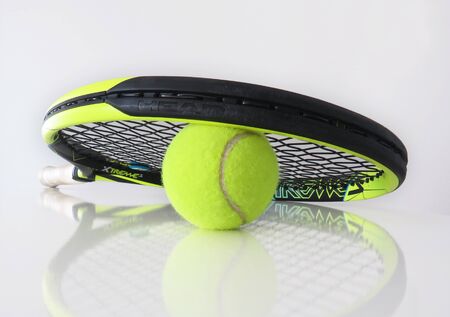 Martinique, January, 7 2010: Tennis ball and racket on white background