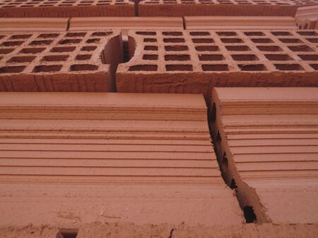 Close up view of red bricks piled. Solid clay bricks used for construction