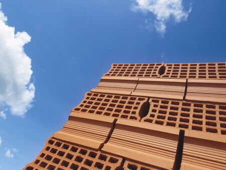Close up view of red bricks piled. Solid clay bricks used for construction