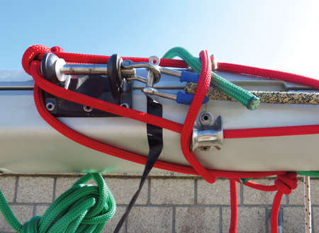 Accessories rigging boats. Capes of different colors on stainless steel structure under blue sky....