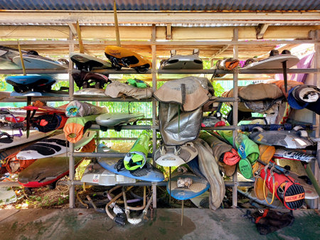 Martinique, Antilles, October, 18, 2021: Windsurfing and kitesurf equipment in a Caribbean hangar. Martinique, French West Indies. Water Sports Equipment and Accessories.のeditorial素材