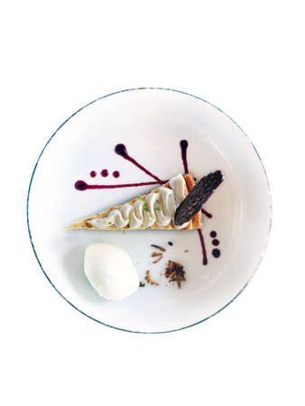 Aerial view of gourmet pie portion on white plate isolated. Cakes and Desserts. Delicatessen and fine pastries.の写真素材