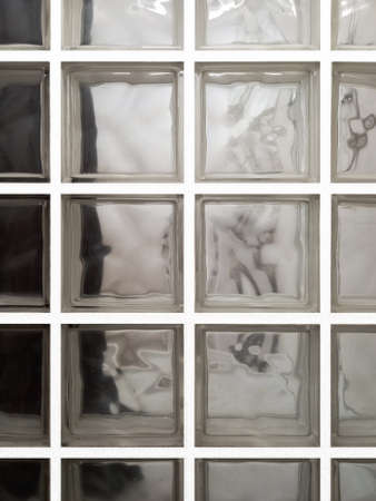 Translucent glass bricks background. Close up of translucent pavÃ© glass. Detail of glass brick wall or glass blocks. Pebble glass full frame. Building material and interior decoration.の写真素材