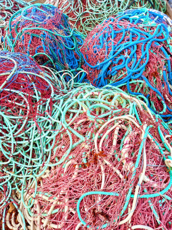Background of Fishing nets of different sizes and colors. Caribbean and tropical close up.