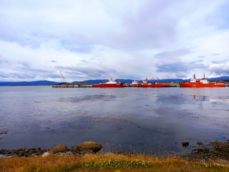 Usuhaia, March 2022: Panoramic view of the Beagle Channel with merchant ships in the icy waters of Usuhaia. Extreme nature and maritime transport and rescue.のeditorial素材