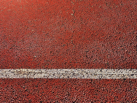 Tennis surface texture with white line. Rough Backgrounds and Textures. Close up of hard tennis court. Racket sports.の写真素材