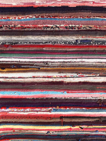 Background of various handmade cotton arabic fabrics. Chill out. Colorful wool Bedouin blankets. Arabic decoration and culture.の素材