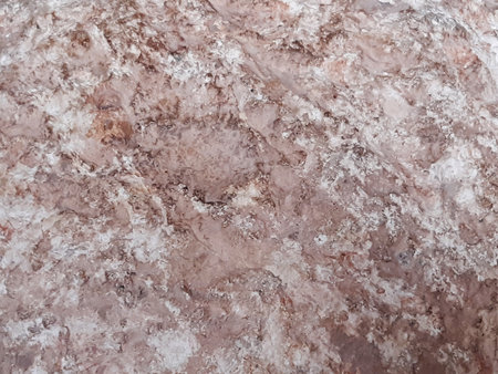 Marble beige stone rough background. Light cement wall texture. Abstract full frame of granite surface.の写真素材