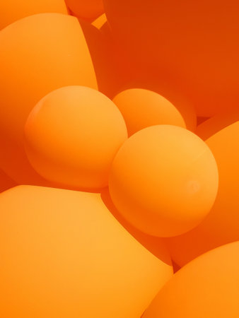 Orange balloons. Festive background. Colorful balloon texture. Beautiful and amazing colorful...