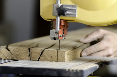 A carpenter works on woodworking the machine tool.の写真素材
