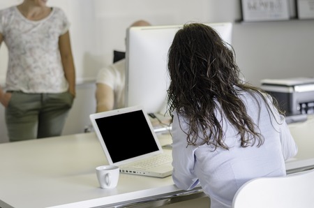 Team working in the office, white laptop.の写真素材