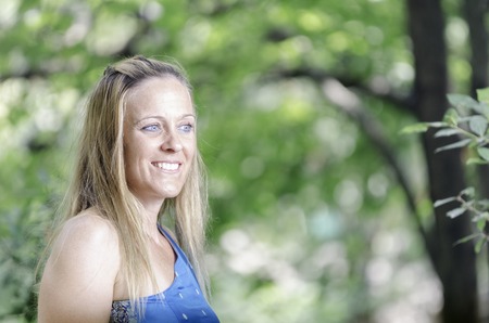 Attractive woman enjoying her time outside in park.の写真素材