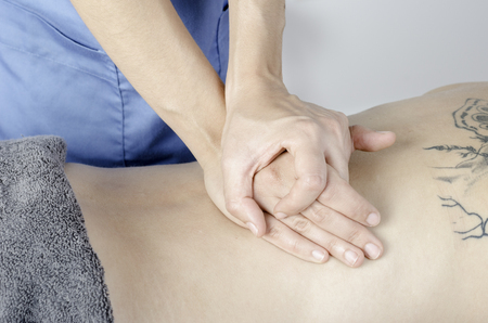 Physiotherapist doing a technique cervical Maitland. Woman patient. PA.の写真素材