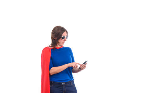 Woman superhero with red cape talking on the phone, white background.