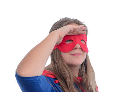 Woman superhero with red cape, white background.の写真素材