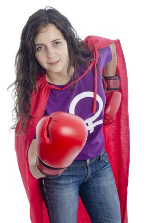 Woman superhero with woman symbol on the t-shirt, red cape and red gloves boxing.の写真素材