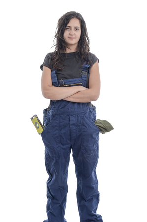 Worker woman with overalls over white background.の写真素材