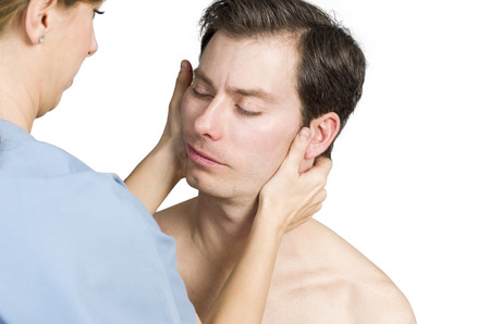 Cervical manipulation with rotation over white backgroundの写真素材