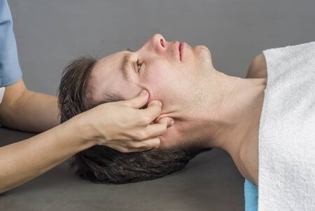Physiotherapist is activating  trigeminal nerve.