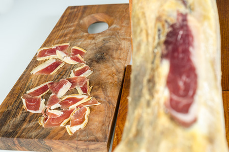 Cured iberian ham leg, bellota ham. Gourmet spanish food.の写真素材