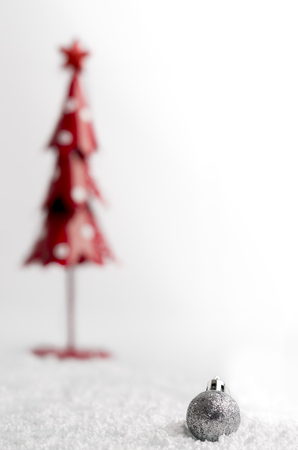 Christmas tree and gray ball with snowflakes on white background.の写真素材