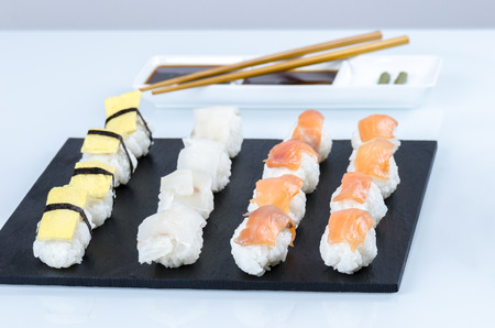 Sushi nigiri set on slate plate, close-up.の写真素材