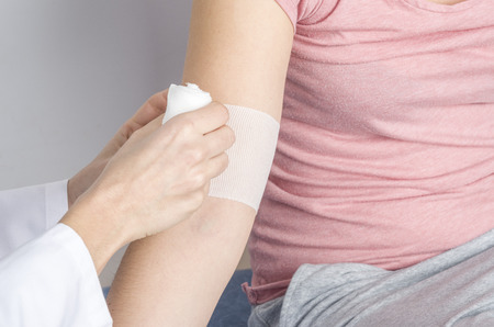 Compression bandage to inflammation, application of figure of eight bandage.の写真素材