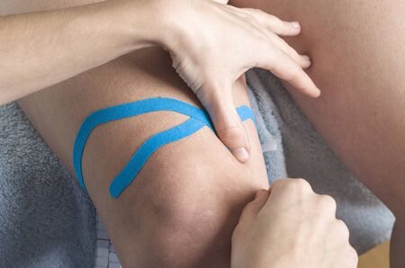 Lymphatic knee technique, two fan strips. Kinesiology Tape.の写真素材