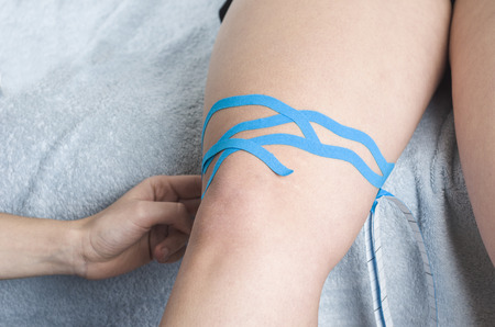 Lymphatic knee technique, two fan strips. Kinesiology Tape.の写真素材