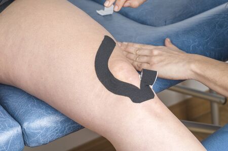 Lymphatic knee technique,  The "Y" strip. Kinesiology Tape.の写真素材
