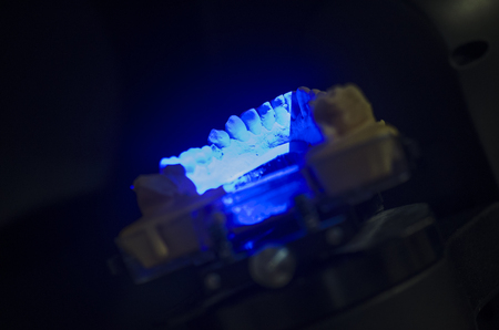 Dental technician scanning a dental cast model in a 3D surface scanners.の写真素材
