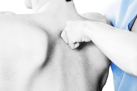 Physiotherapist is testing low dorsal over white background. Quick scanの写真素材