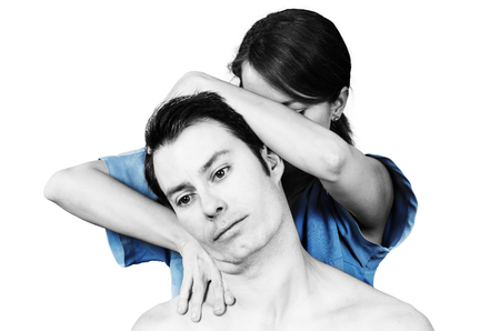 Cervical manipulation with axial compression over white backgroundの写真素材