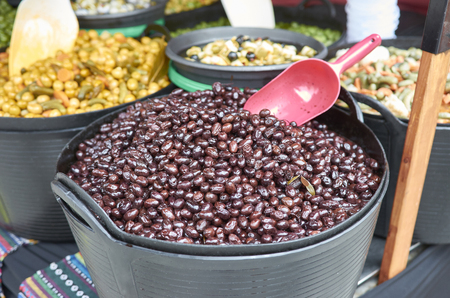 Varieties of many olives on a market in Valenciaの写真素材