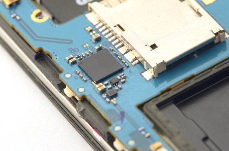 Disassembly of smartphone showing electrical board inside.