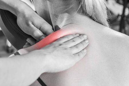 Chiropractor, physiotherapist examining her patient back and doing decontracting massage. Osteopathy.の写真素材