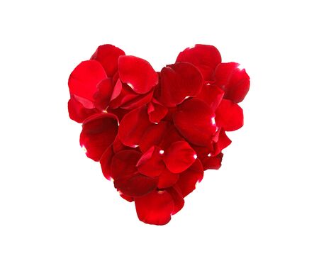 Rose petals in heart shape isolated on white background. Top viewの写真素材
