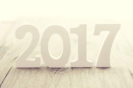 Composition with a wooden number 2017 as a symbol of the coming New Year. Happy New Year concept on...