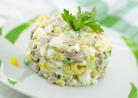 Salad from canned corn, sausage, eggs and onion.の写真素材