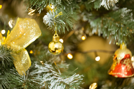 New year backdrop. Holiday background with Christmas tree and golden decoration. Christmas mock-up or greeting card.の写真素材