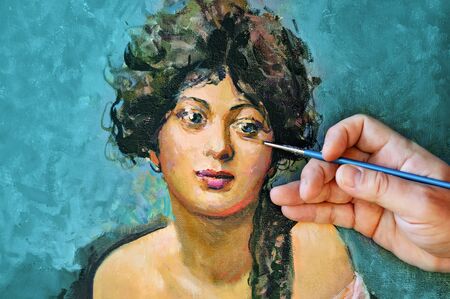 Portrait of young woman and artist hand with brushの写真素材