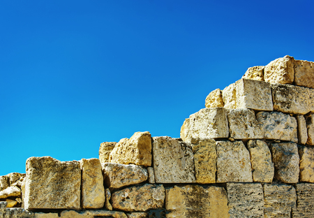 Stone wall against the sky. Ancient ruins of Chersonese. Sevastopol. Ukraine.の写真素材