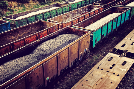 Loaded railcars from above. Cargo transportation by rail.
