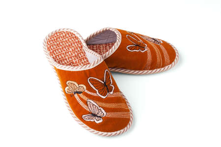 Slippers with butterflies on a white background.の写真素材