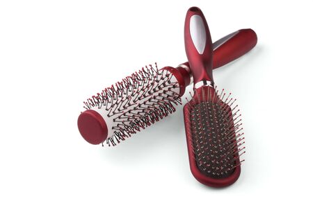 There are two red hairbrushes.の写真素材